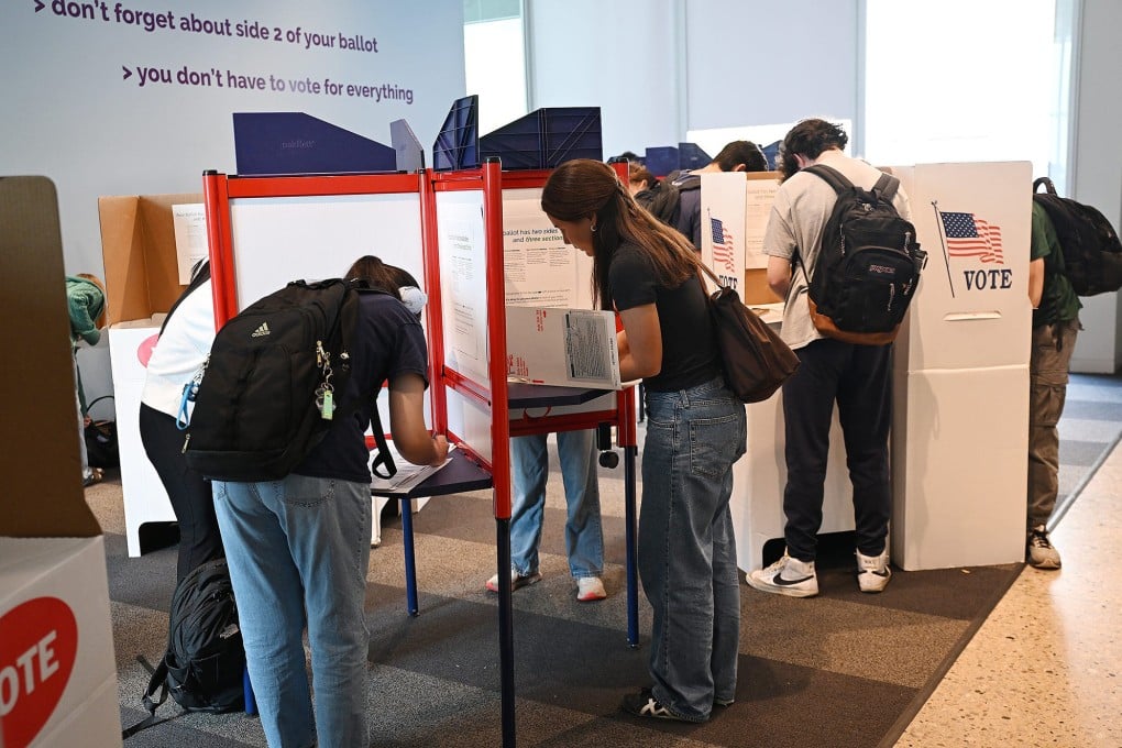 College students mark ballots at an early voting site inside the University of Michigan Museum of Art in Ann Arbor in October 2024. Photo: TNS