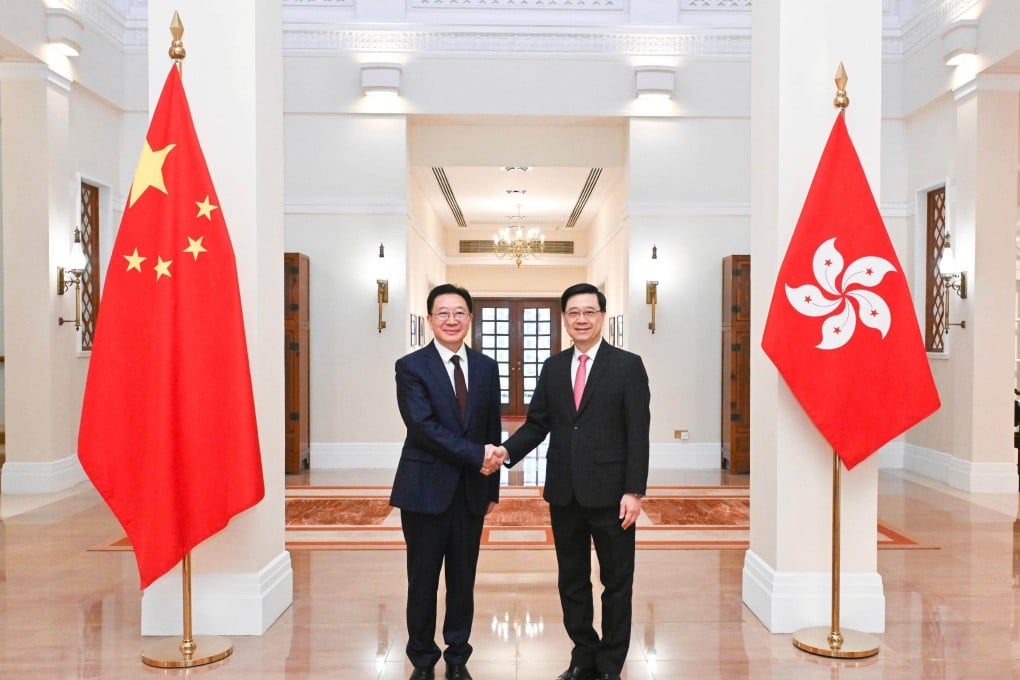Liaison office Director Zhou Ji (left) meets Hong Kong leader John Lee at Government House on Saturday. Photo: ISD