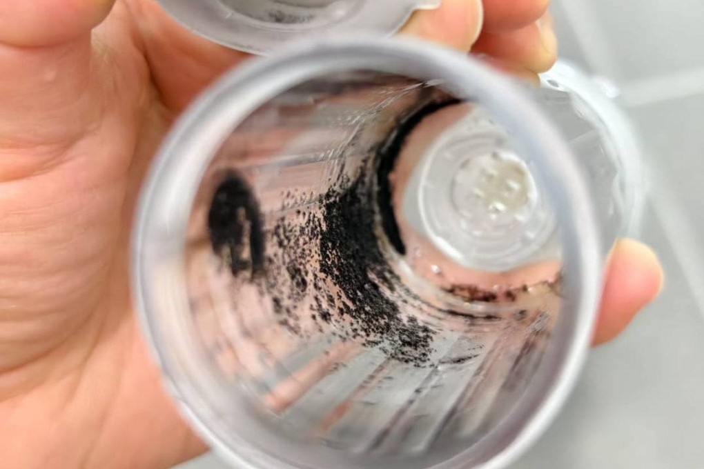 Black particles that have collected inside a water filter. Photo: Facebook/Desmond Wang
