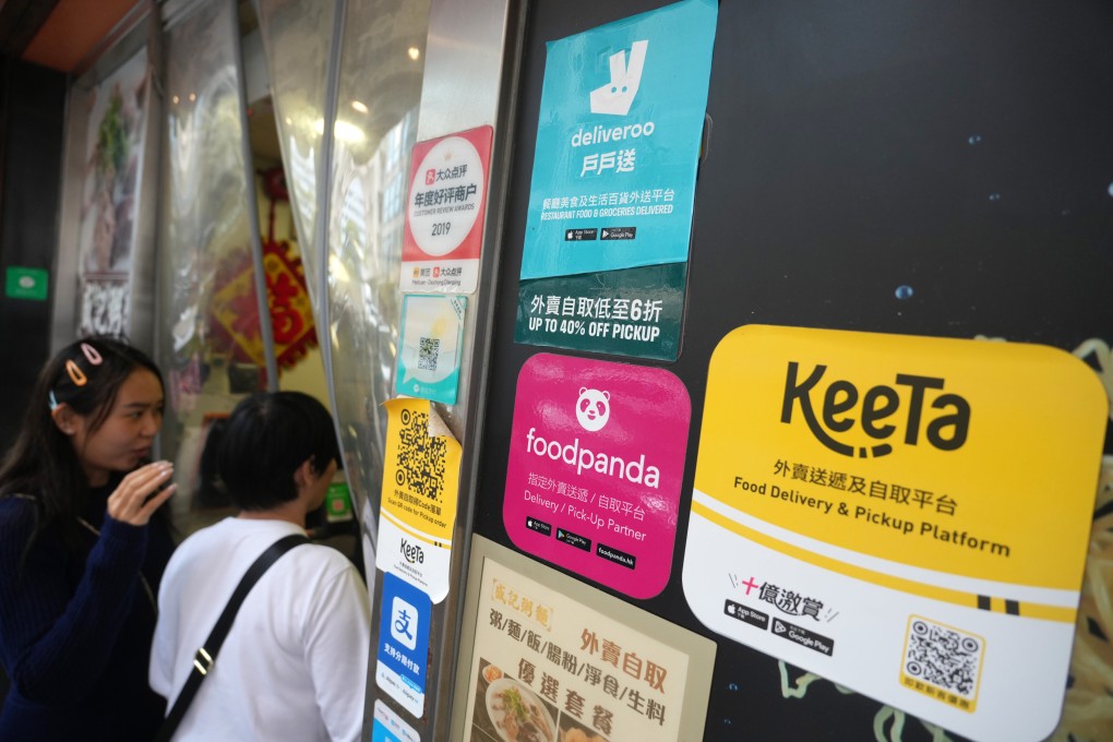 Food delivery stickers at a restaurant in Jordan. Labour sector lawmaker Kwok Wai-keung has urged authorities to speed up the creation of regulations requiring delivery platforms to more stringently monitor the identity of their riders. Photo: Sam Tsang