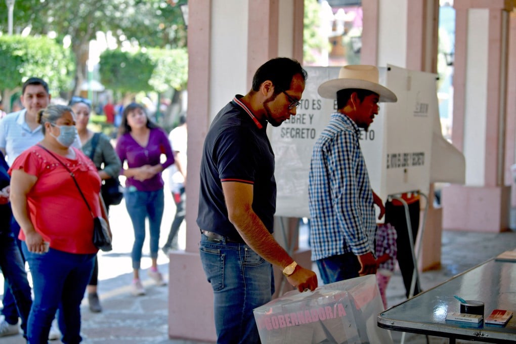 People vote at a polling station in June 2023, during gubernatorial elections in the State of Mexico. On Sunday, Mexico votes in its first judicial election. Photo: TNS