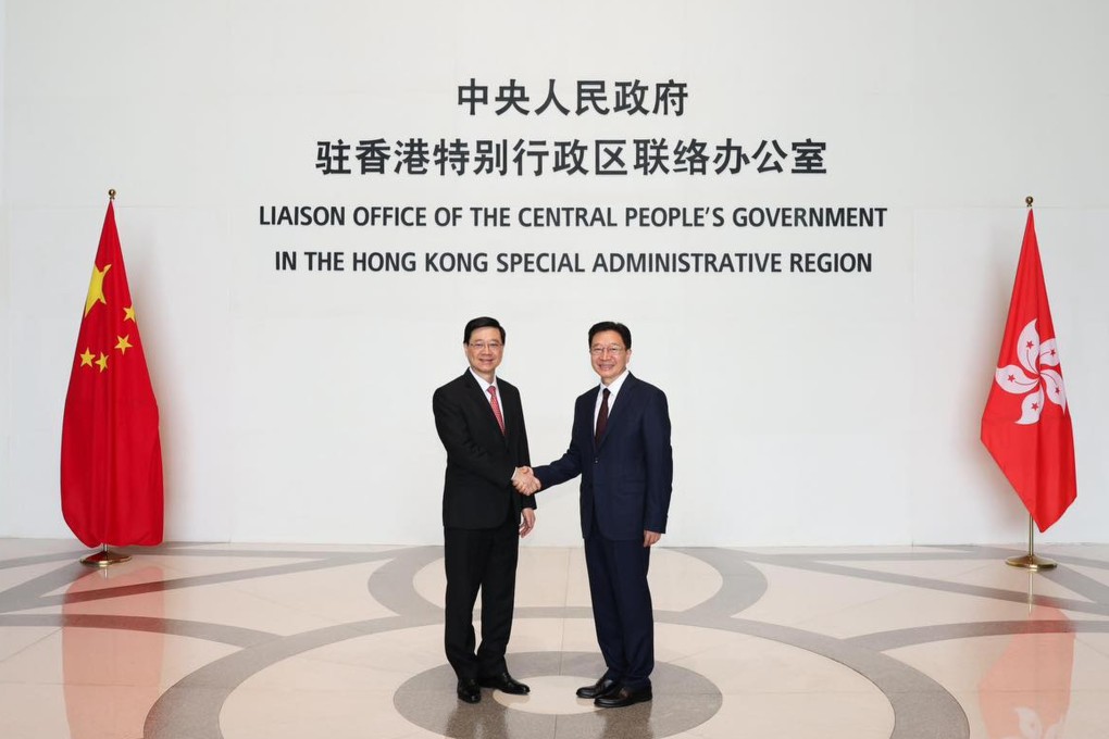 Liaison office Director Zhou Ji (left) and Chief Executive John Lee meet on Monday. Photo: Handout