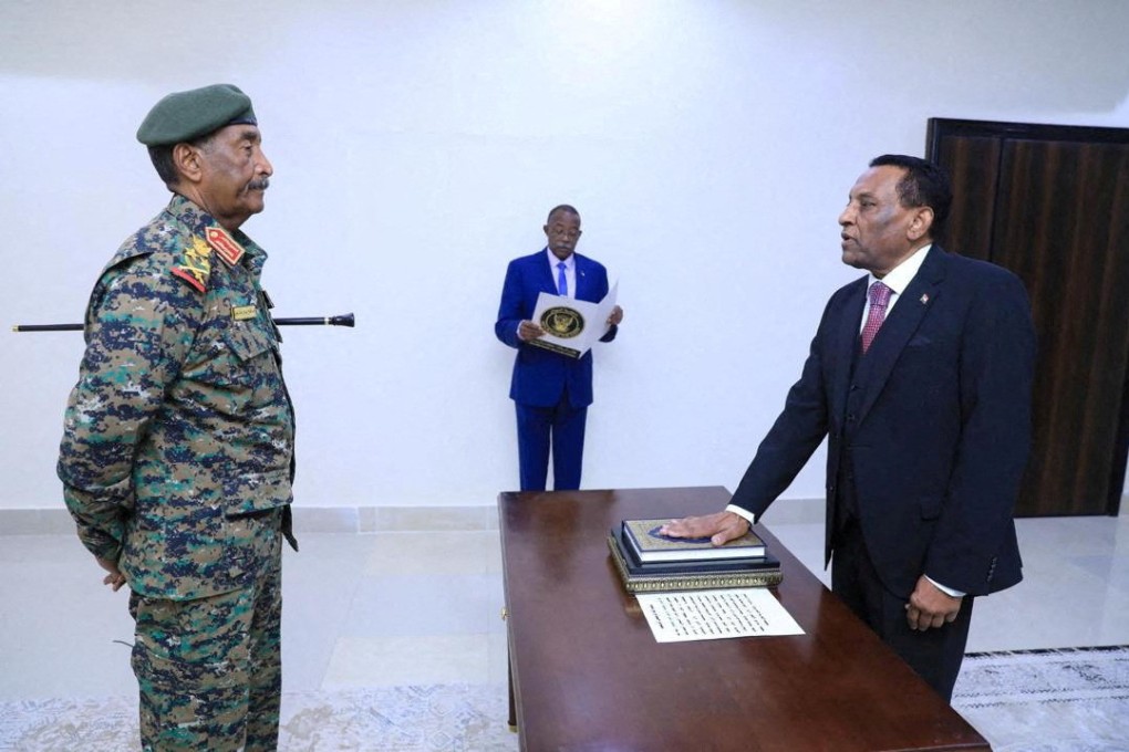 Kamil Idris being sworn in as Sudan’s new prime minister on Saturday. Photo: Sudan Transitional Sovereignty Council via Reuters
