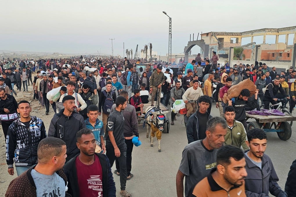 Displaced Palestinians return from a food distribution centre in Rafah in the southern Gaza Strip on Sunday. Gaza rescuers said Israeli gunfire killed several people. Photo: AFP