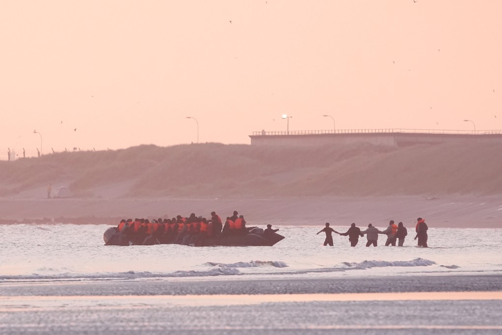People thought to be migrants board a small boat leaving the beach at Gravelines, France, in an attempt to reach the UK by crossing the English Channel on Sunday. Photo: PA via dpa