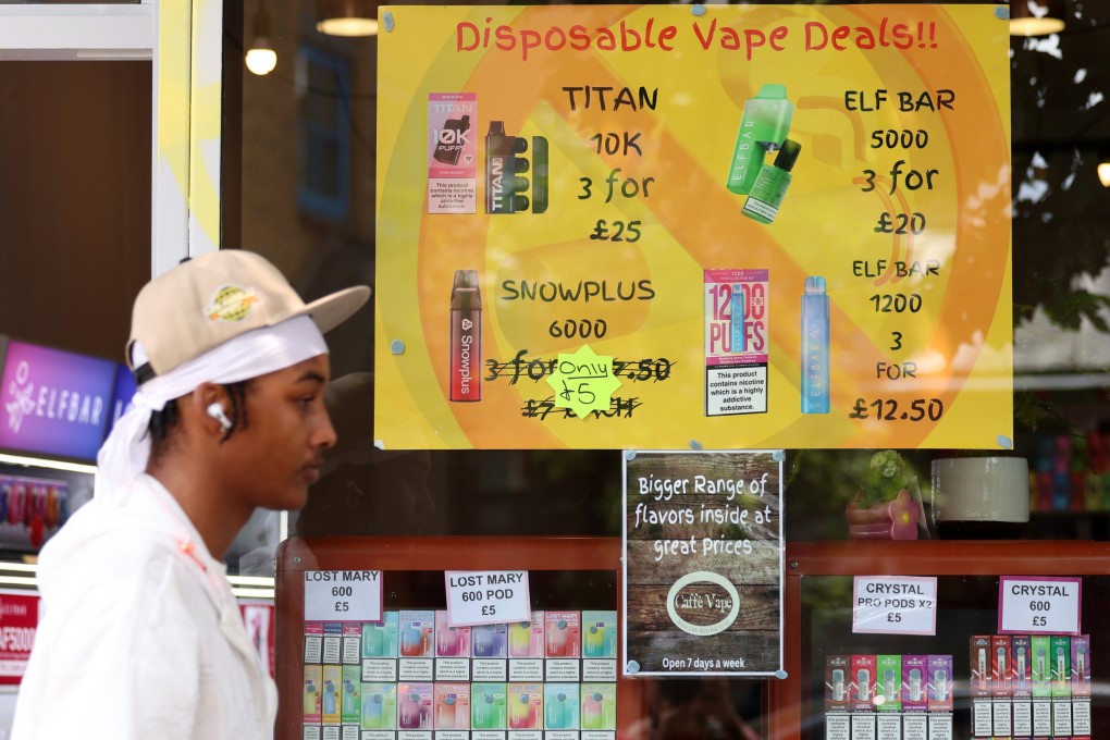 A pedestrian walks past a vape shop in London on before the ban. Photo: EPA-EFE