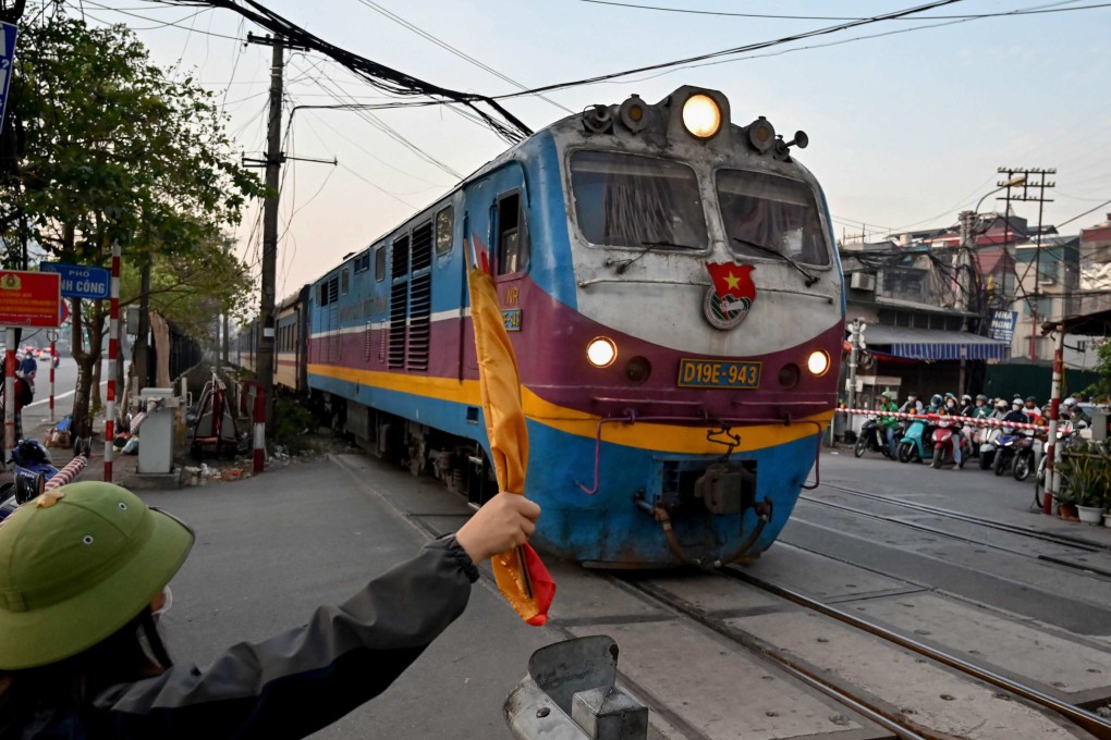 A passenger train at a railway crossing in Hanoi last year. Vietnam approved the new high-speed railway in November as part of efforts to modernise the country’s colonial-era railway system. Photo: AFP