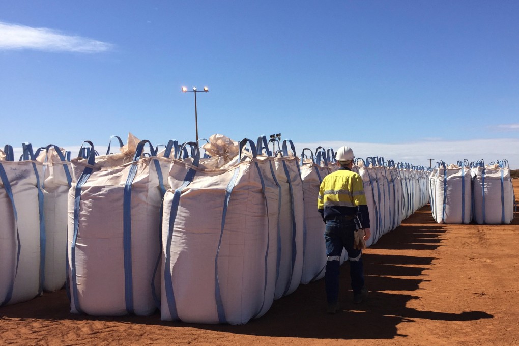 A Lynas worker walks past sacks of rare earth concentrate waiting to be shipped to Malaysia at Mount Weld in Australia.  Photo: Reuters
