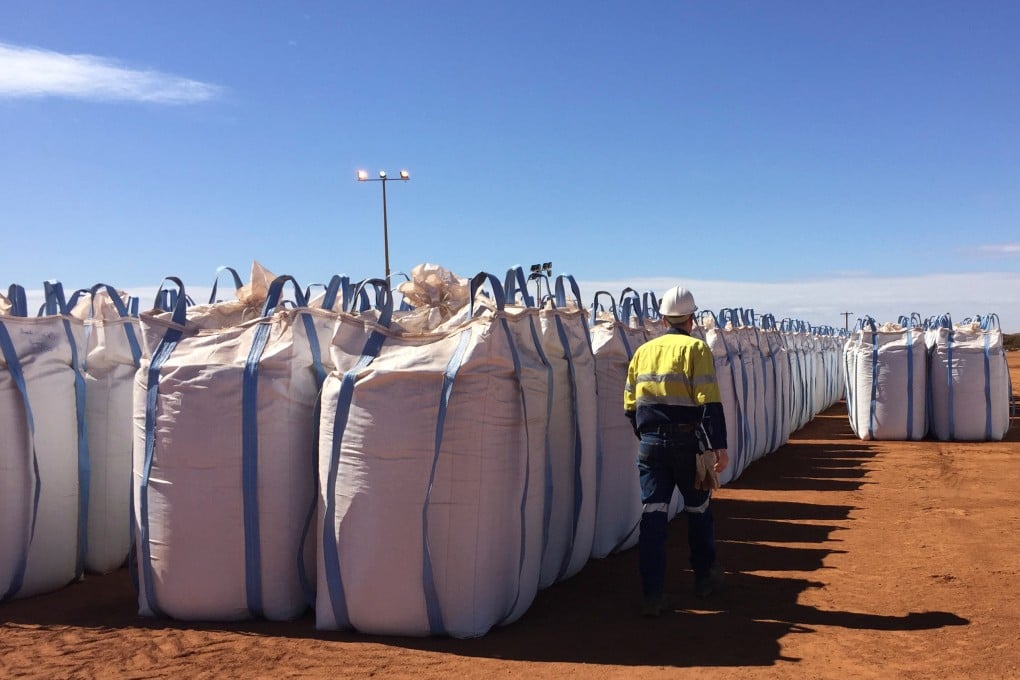 A Lynas worker walks past sacks of rare earth concentrate waiting to be shipped to Malaysia at Mount Weld in Australia. Photo: Reuters