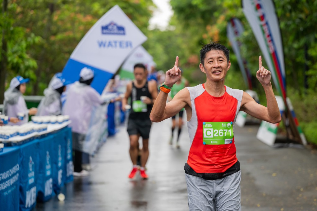 Eddie Chang running in the Standard Chartered Singapore Marathon in 2023. The Westin Singapore hotel’s first run concierge gives advice for mature runners, and running on city streets. Photo: Eddie Chang