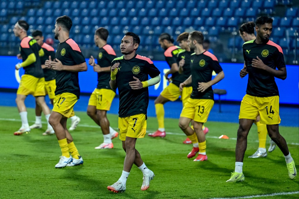 Malaysia’s Faisal Halim (centre) warms up before the Asian Cup qualifier against Nepal in Johor Bahru, Malaysia in March. Photo: AFP