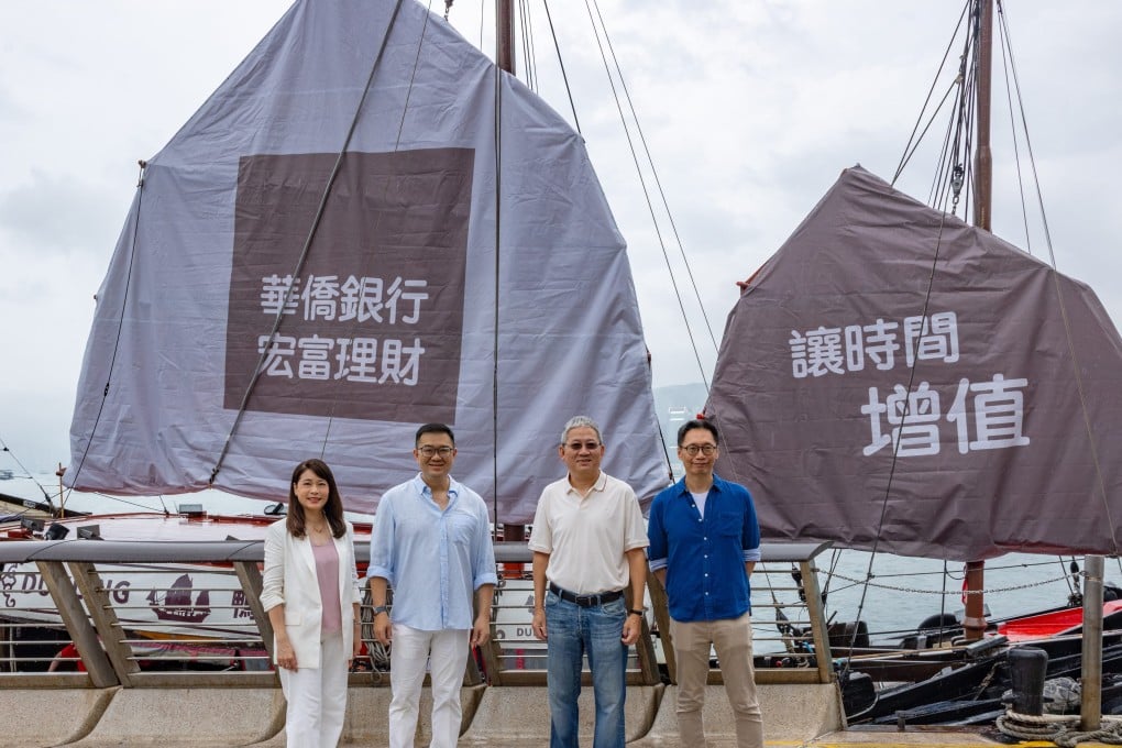 OCBC Singapore and Hong Kong executives set sail on the Dukling. The bank’s logo is represented by a Chinese sailing ship.