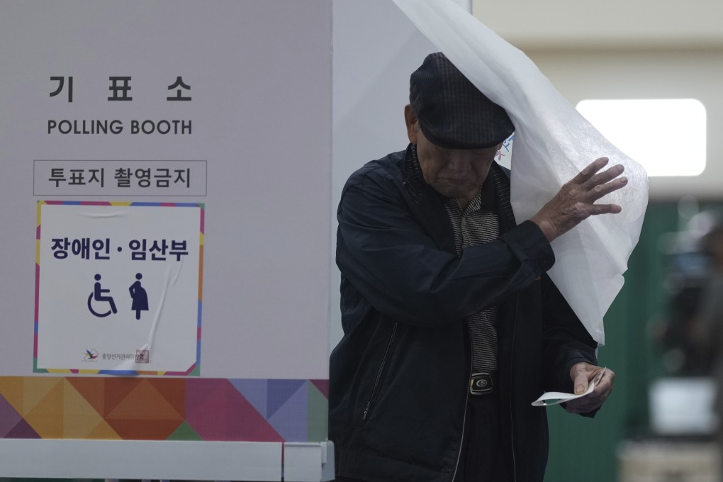 A man exits a polling booth to cast his ballot in South Korea’s presidential election in Seoul on Tuesday. Photo: AP