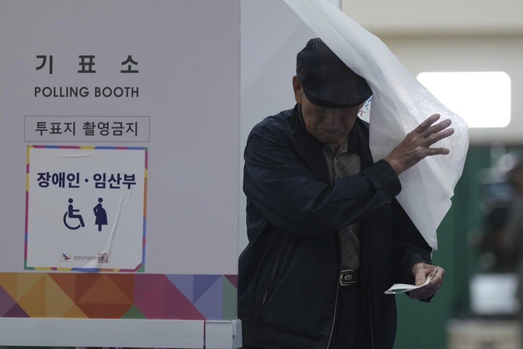 A man exits a polling booth to cast his ballot in South Korea’s presidential election in Seoul on Tuesday. Photo: AP