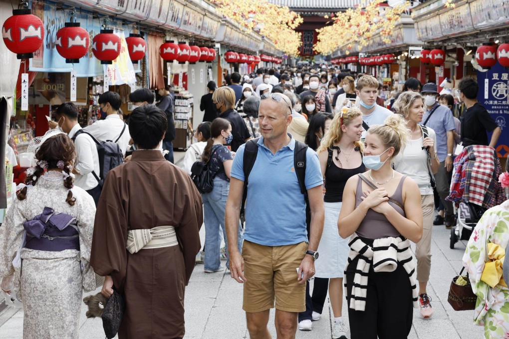 People walk along Nakamise shopping street in Tokyo’s Asakusa area. Photo: Kyodo