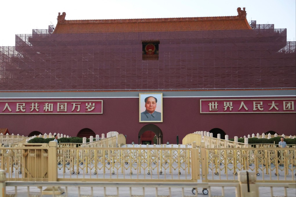 Security personnel keep watch near the portrait of Mao Zedong displayed on the Tiananmen Gate in Beijing on June 3. Photo: Reuters