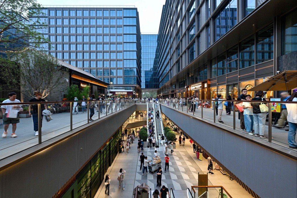 People visit the newly renovated Dajixiang shopping complex in Beijing on Sunday. Photo: AFP