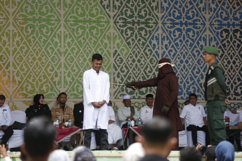 An man receives up to 100 lashes of caning in public, for adultery and breaking Sharia law, in Banda Aceh, Indonesia on Wednesday. Aceh is the only province in Indonesia that enforces the Sharia law. Photo: EPA-EFE