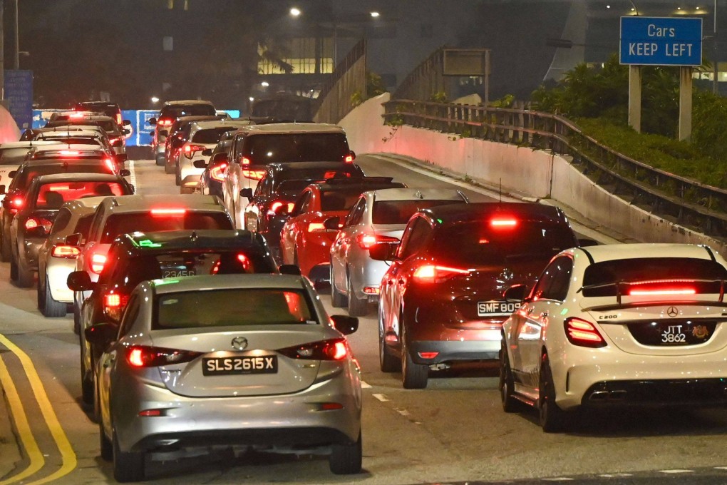 Cars queue up to enter the Woodlands Checkpoint in Singapore before crossing the causeway to Johor Bahru, Malaysia. Photo: AFP