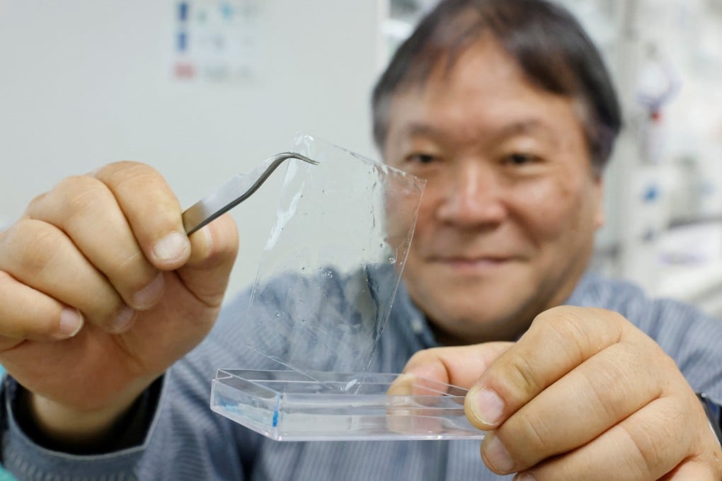 Takuzo Aida, group director at the Riken Centre for Emergent Matter Science, shows a sample of ocean-degradable plastic. Photo: Reuters