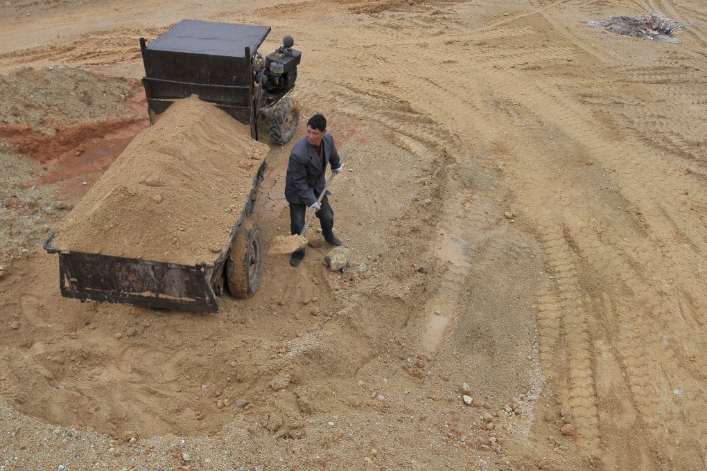 A labourer works at the site of a rare earth metals mine in Jiangxi province. Photo: Reuters