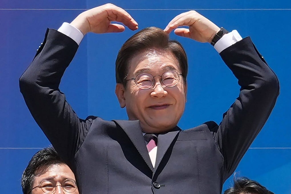 South Korea’s President Lee Jae-myung makes an arm heart gesture to supporters outside the National Assembly on Wednesday. Lee has pledged to foster warmer ties with Japan. Photo: AFP