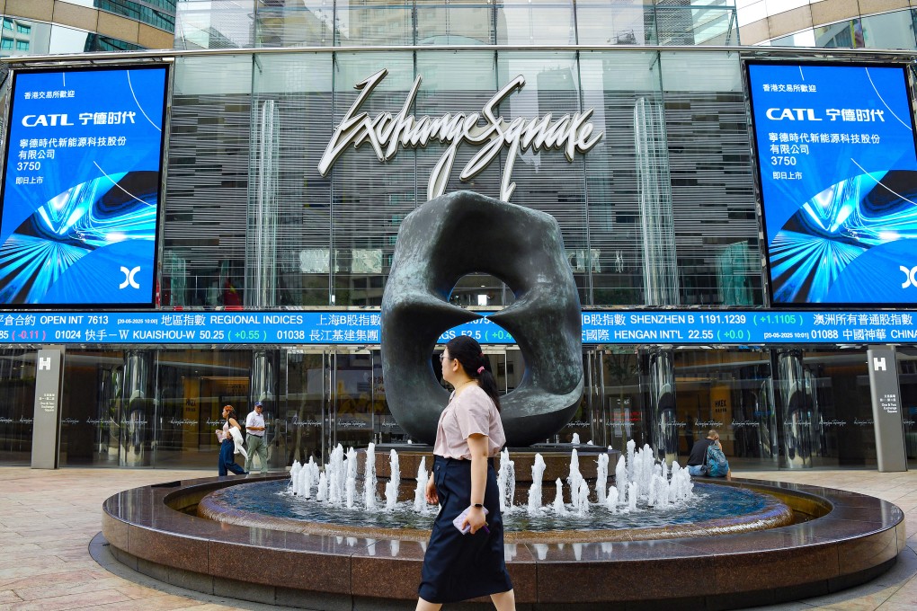A woman passes through Exchange Square in Hong Kong. Photo: Xinhua