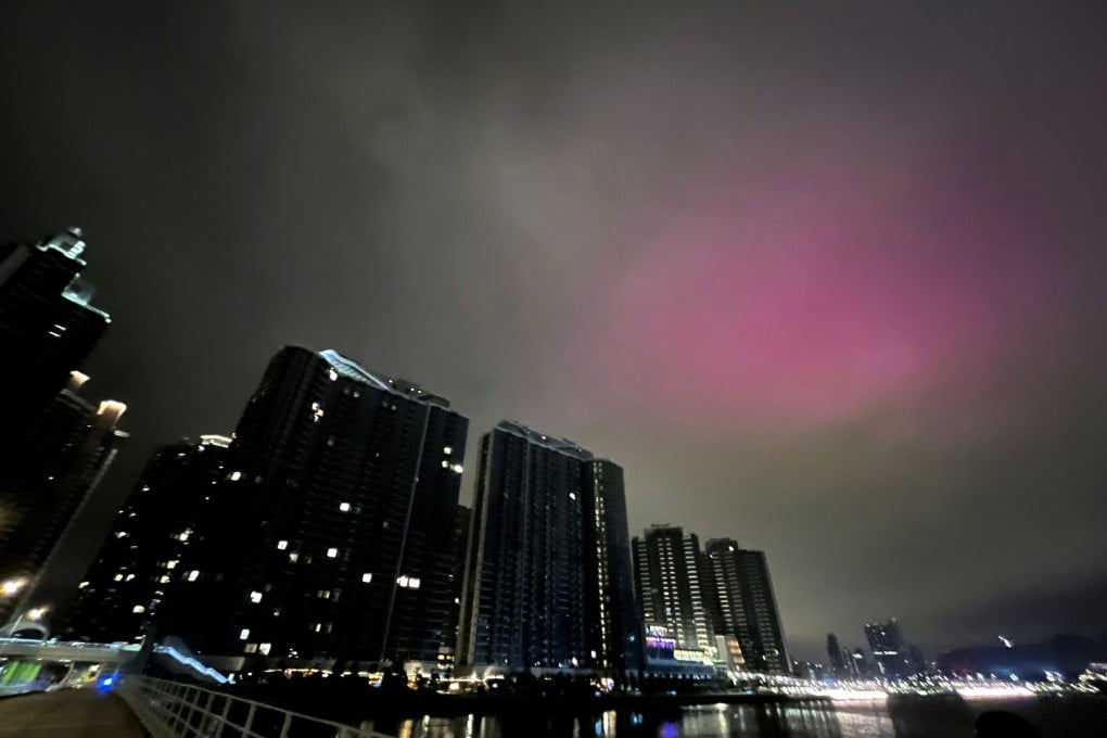 A pink glow fills the morning sky above Kai Tak. Photo: Nora Tam