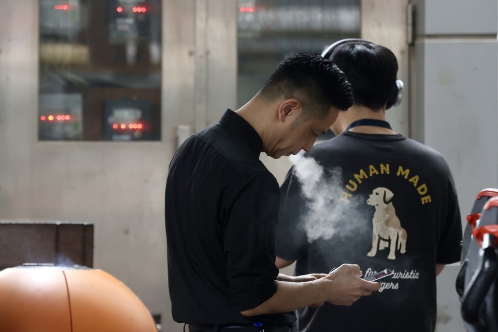People vape in Central district on April 25. Photo: Jonathan Wong