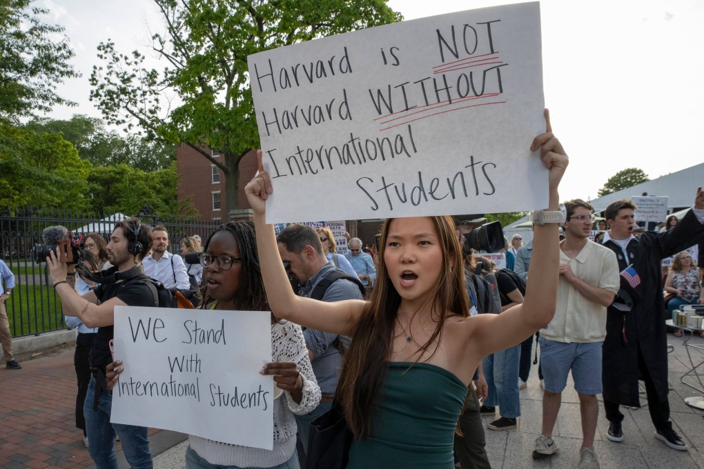People hold up signs during the Harvard Students for Freedom rally in support of international students at the university’s campus in Boston, Massachusetts, in May. Photo: AFP