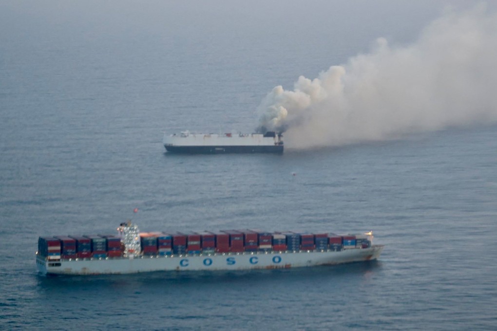 Smoke rises from the Morning Midas, which was carrying around 3,000 vehicles. Photo: US Coast Guard via Reuters