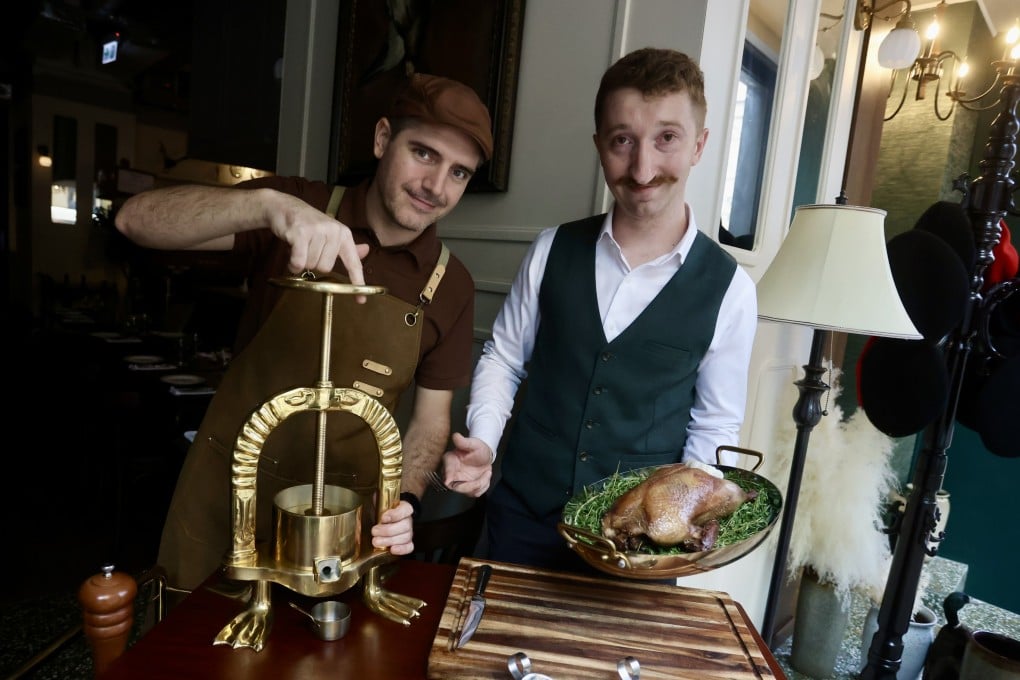Chef Guillaume Sejourne (left) and manager Hubert Dubouix at Le Colvert, the Hong Kong bistro making French fine-dining dish pressed duck “a little less formal”. Photo: Jonathan Wong