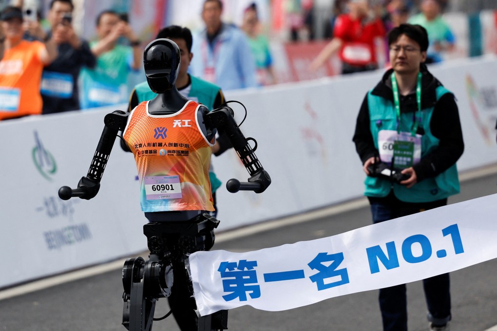 Tiangong Ultra, a humanoid robot, crosses the finish line first during the E-Town Humanoid Robot Half Marathon, in Beijing, on April 19. Photo: Reuters