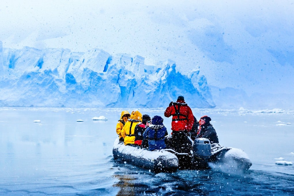 A Zodiac takes tourists up close to a glacier on the Antarctic Peninsula, in the Southern Ocean. Photo: Shutterstock