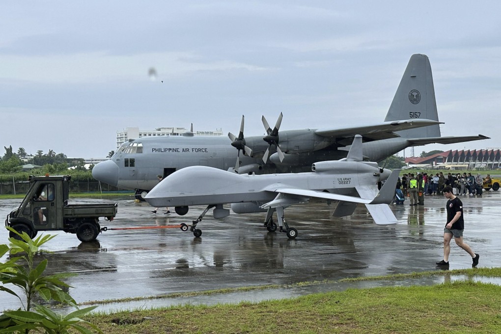 A US navy drone positioned beside a Philippine C130 plane at the airport of Zamboanga, southern Philippines on Tuesday. Photo: AP