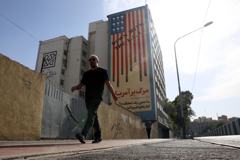 A man walks in front of an anti-American mural next to the former US embassy in Tehran, Iran, on Thursday. Photo: EPA-EFE