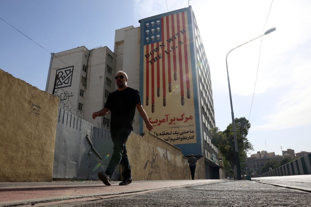 A man walks in front of an anti-American mural next to the former US embassy in Tehran, Iran, on Thursday. Photo: EPA-EFE
