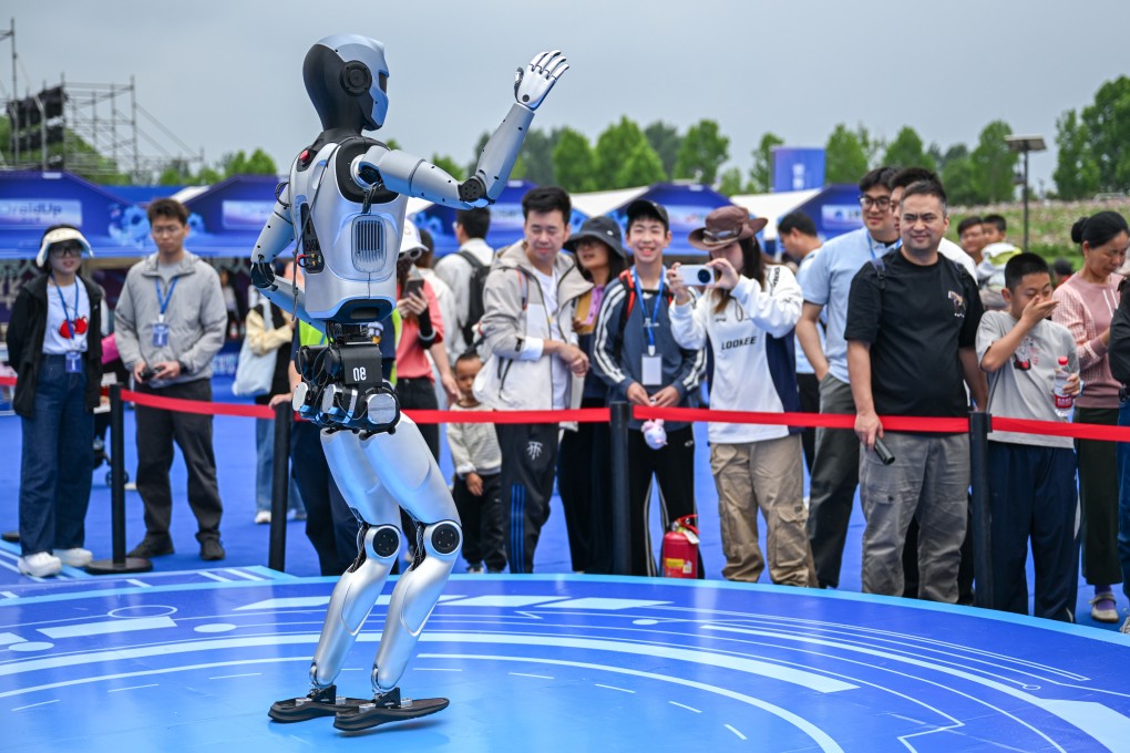Visitors watch a robot performing during the world robot carnival in Wuhan this week. Photo: Xinhua