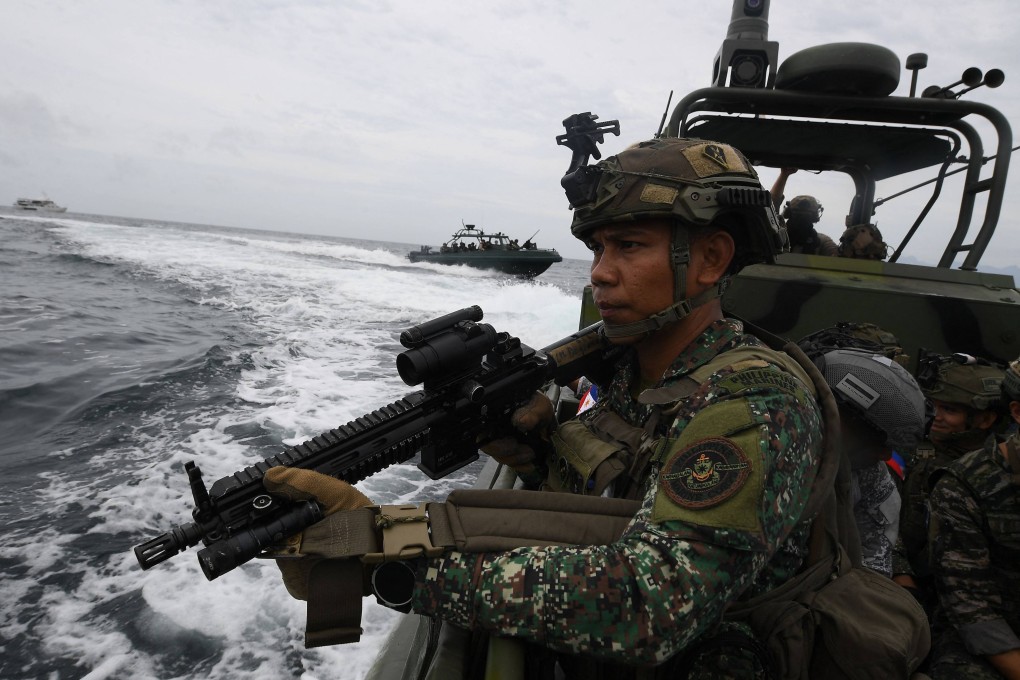 A Philippine marine stands guard during a joint exercise with their US and South Korean counterparts, with members of Japan’s self-defence forces as observers in October 2024. Photo: AFP