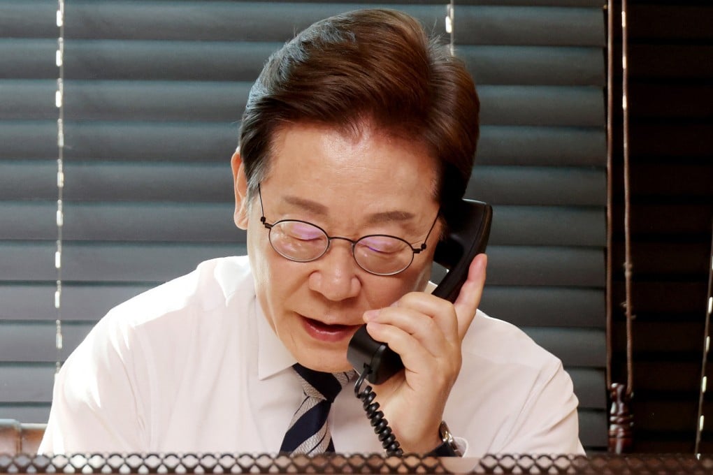 South Korean President Lee Jae-myung speaks on the phone at his residence in Incheon, South Korea, on Wednesday. Photo: Yonhap/AFP