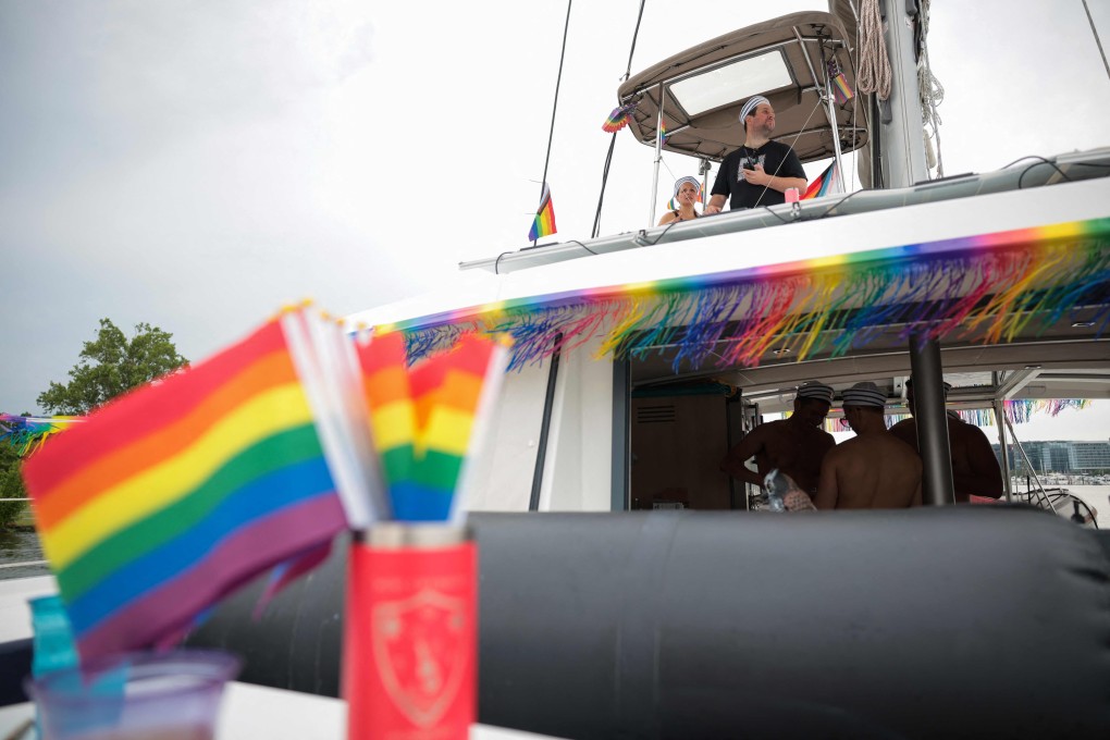 Participants on a catamaran prepare for the Pride on the Pier boat parade, part of the World Pride festival, at the DC Wharf, in Washington on Friday. Photo: AFP