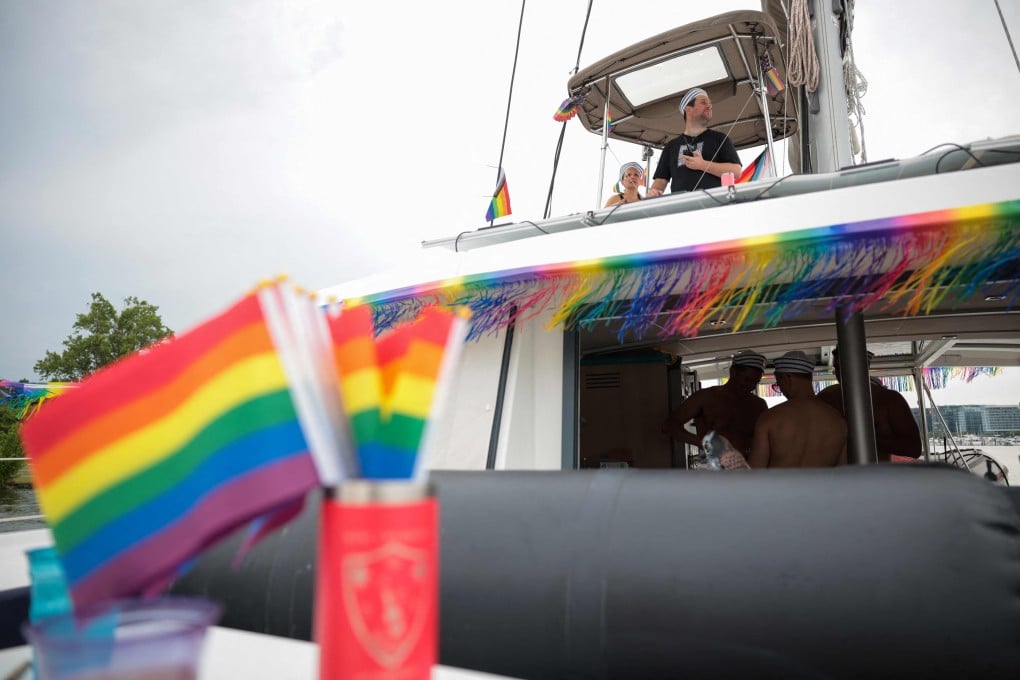 Participants on a catamaran prepare for the Pride on the Pier boat parade, part of the World Pride festival, at the DC Wharf, in Washington on Friday. Photo: AFP