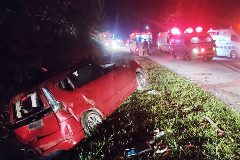 A minivan is seen after it collided with a bus in Gerik-Jeli, in Malaysia’s Perak state. Photo: Perak Fire and Rescue Department/AFP