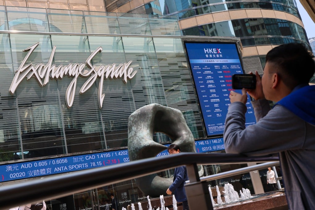 A person takes a picture of Exchange Square in Central, home of stock exchange operator Hong Kong Exchanges and Clearing, on April 7, 2025. Photo: Jelly Tse