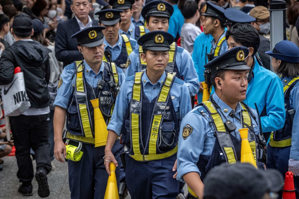 Police officers stand guard during an event in Tokyo in October 2024. Photo: AFP