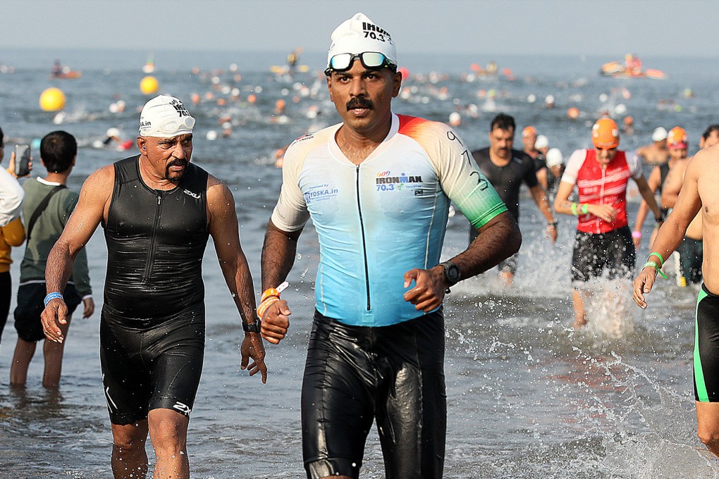Cancer survivor Nidhin Valsan finishes the 1.9km-long swimming leg of the Ironman 70.3 Goa competition in 2022. Photo: Nidhin Valsan
