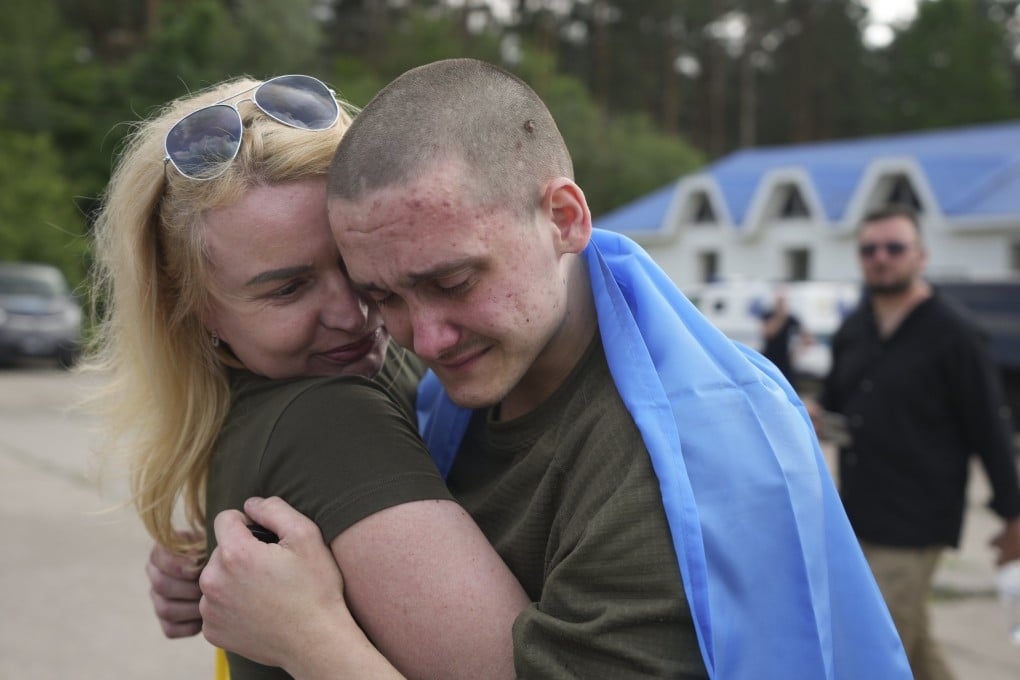 Ukrainian prisoners of war hug after being freed on Monday. Photo: via EPA-EFE