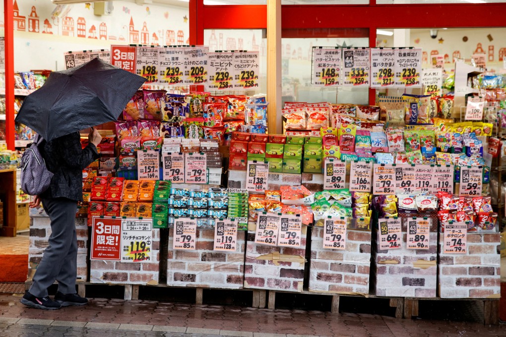 A customer looks at items at a shop in Tokyo, Japan. The country’s economy contracted 0.2 per cent in the January-March period from the previous quarter. Photo: Reuters