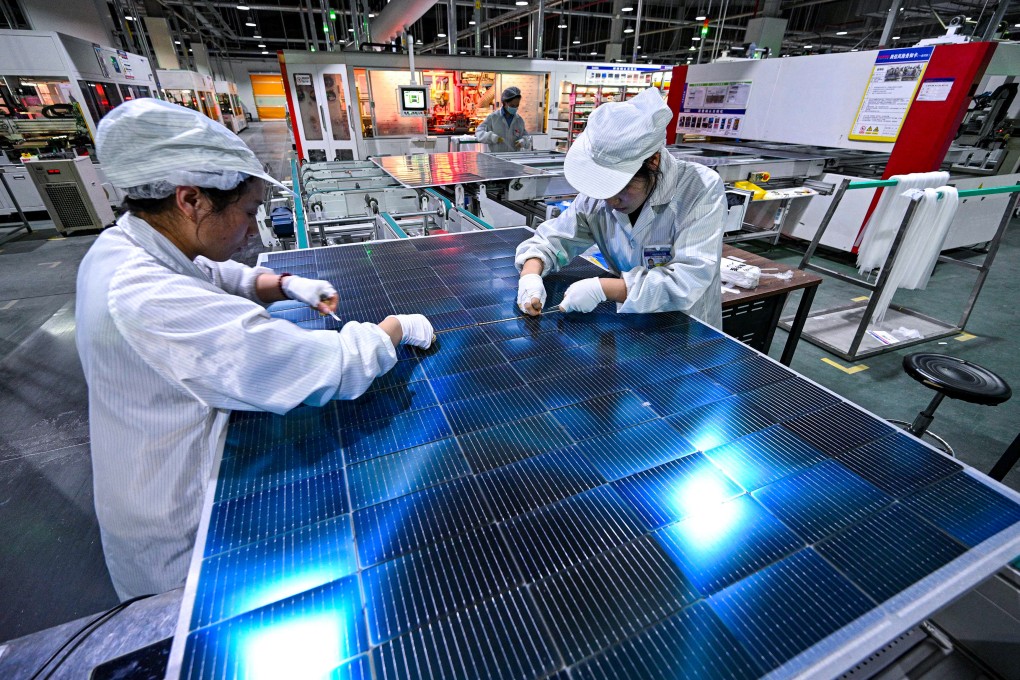 Workers producing photovoltaic modules for solar panels in a factory in Suqian, Jiangsu province in January 2025. Photo: AFP