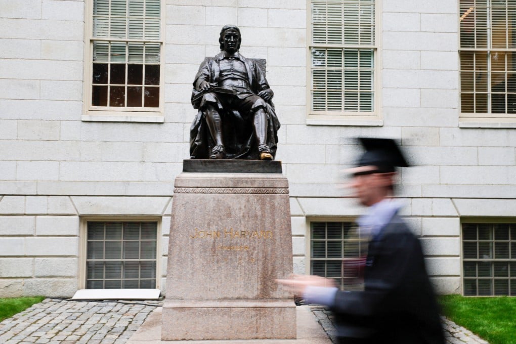 A student walks past the statue of John Harvard. US President Trump has sought to bar the entry of foreign nationals to Harvard University. Photo: Reuters